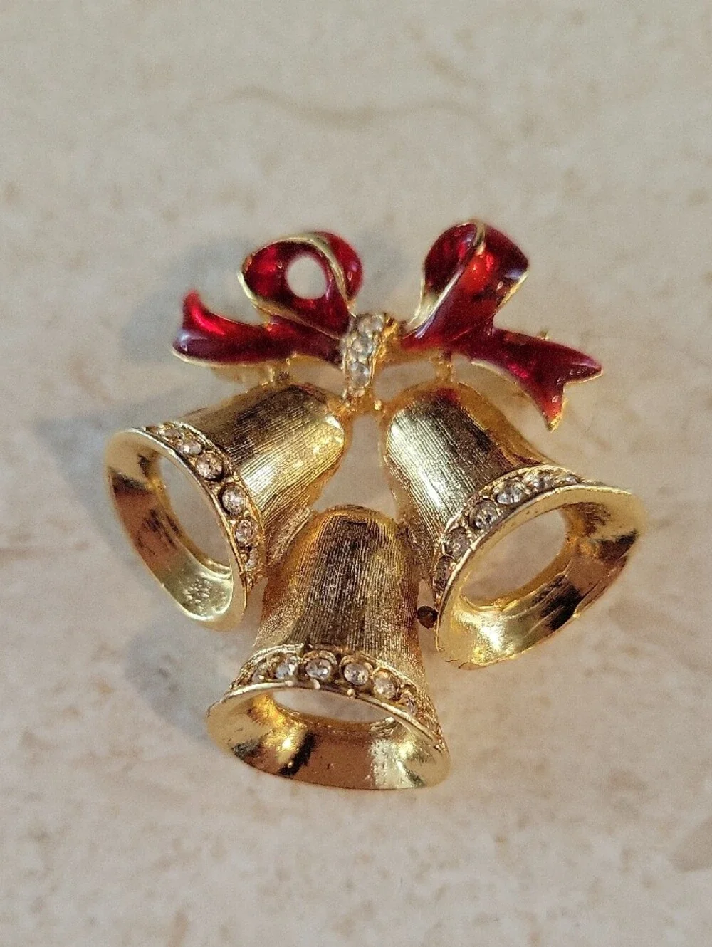 Gold-tone Holiday Bells Brooch with Red Enamel Bow